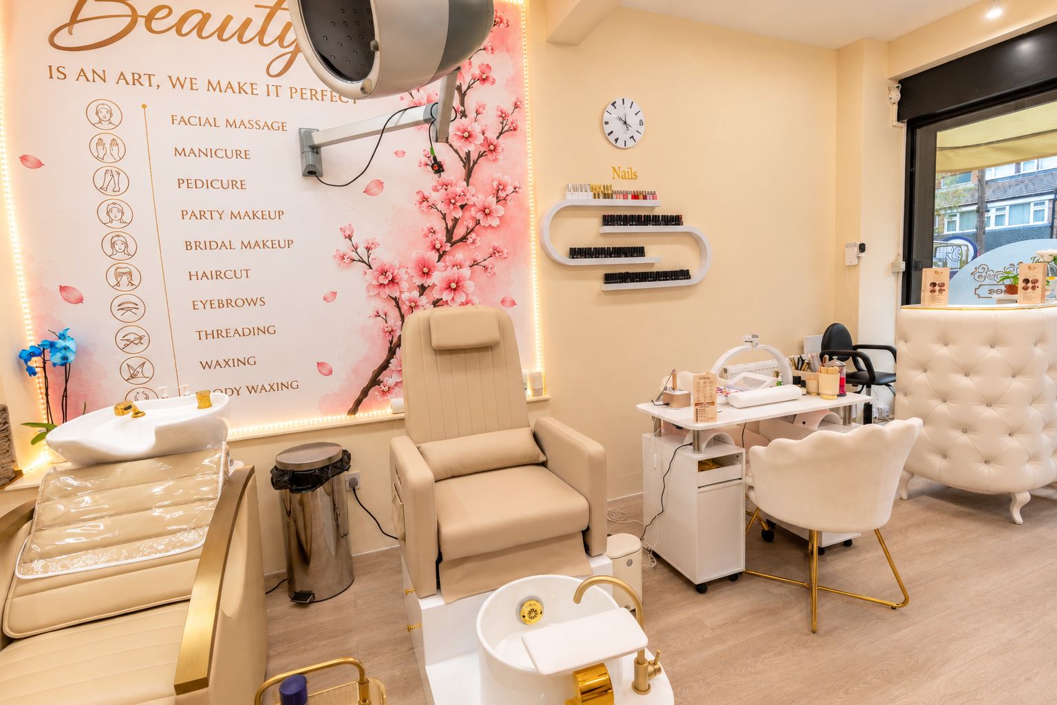 The beauty wall listing treatments beside cherry blossom artwork